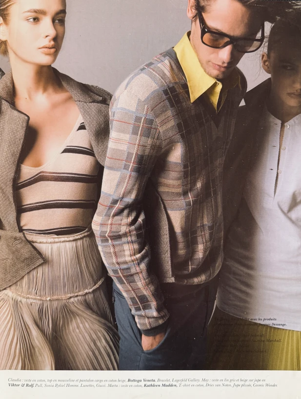 May Gil modelling next to a male model and another female model.